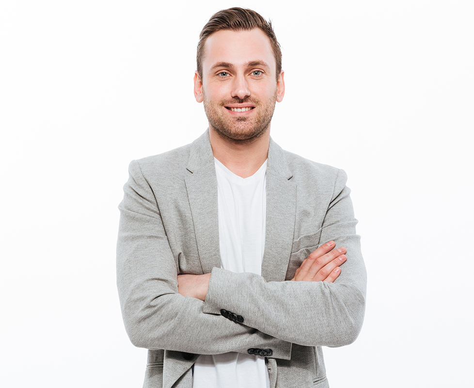 Portrait of successful man having stubble posing on camera with
